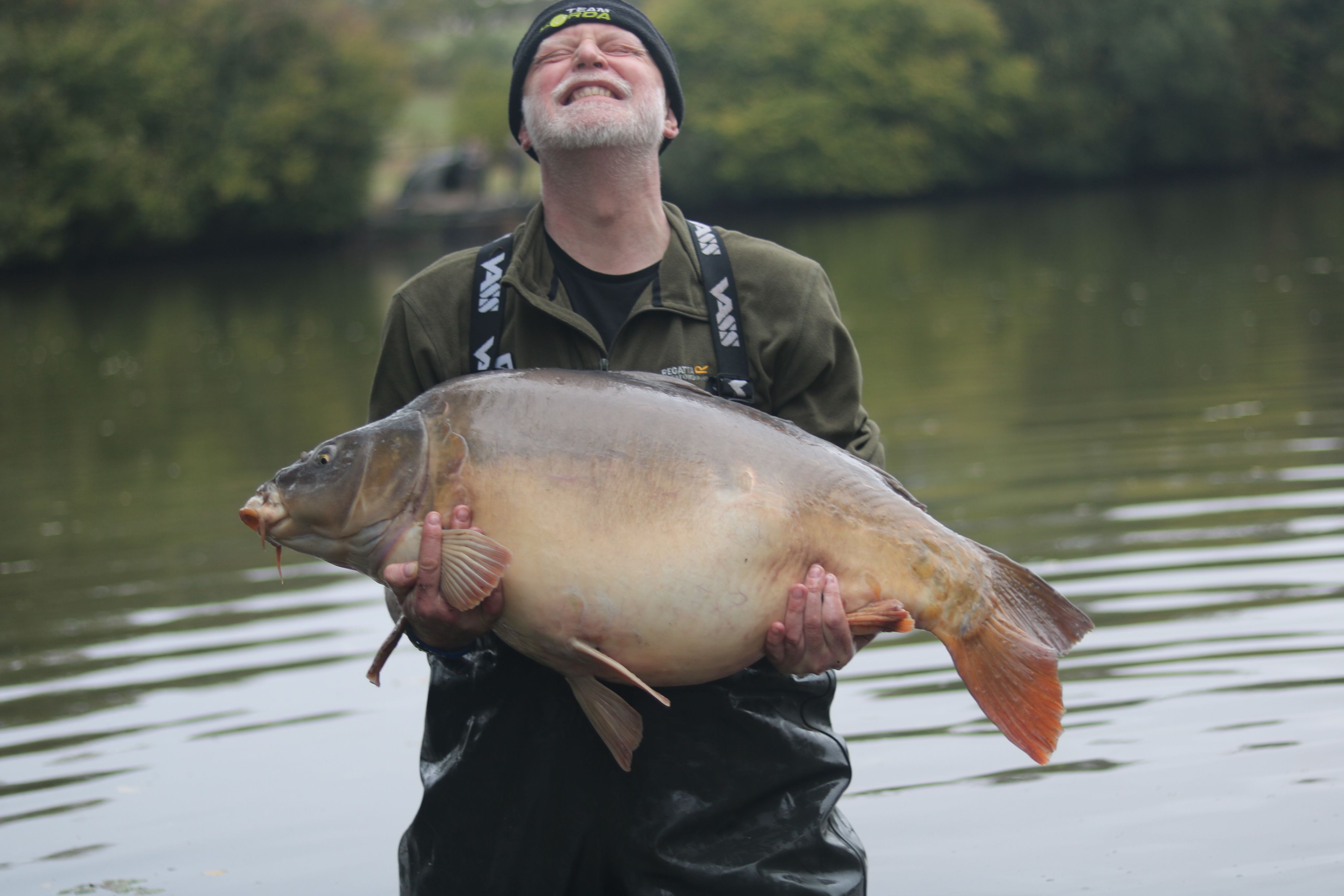 A veteran holding up a mirror carp