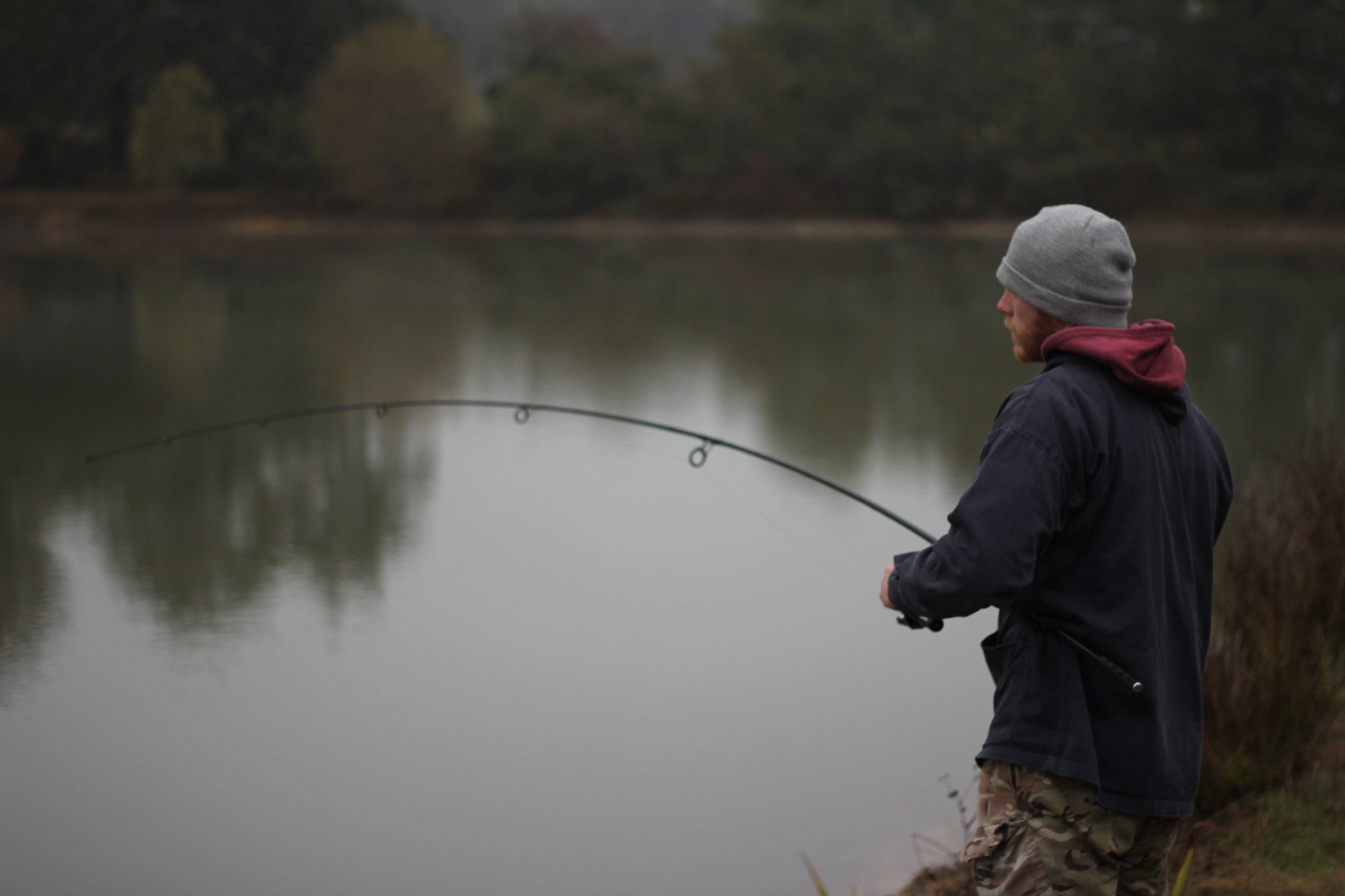 A man fishing in a lake.