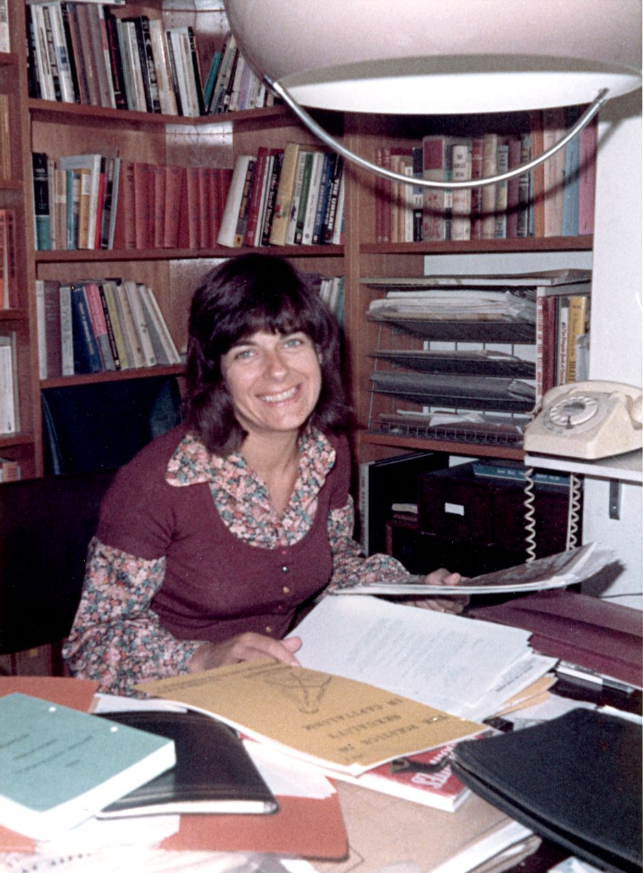 Mary McIntosh sitting in her office