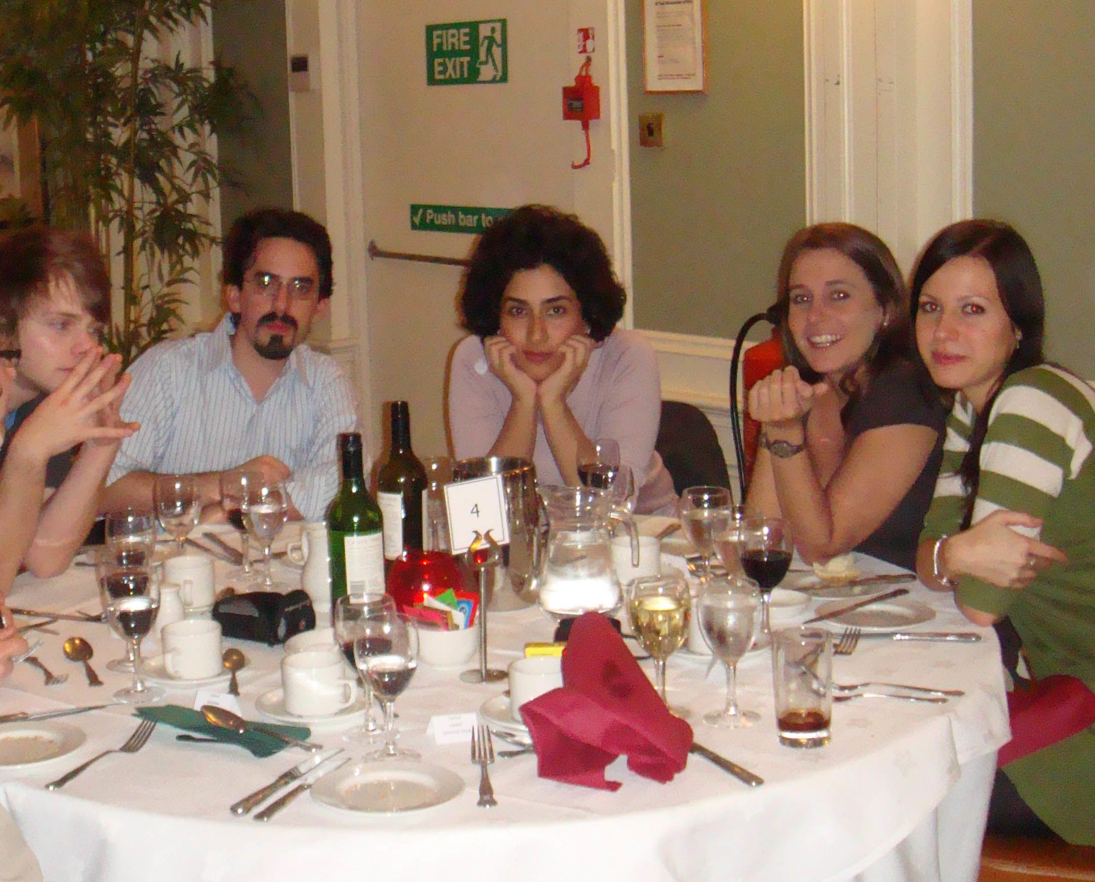 People sitting around table at Graduate conference