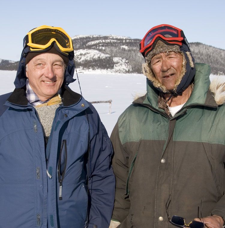 Colin Samson outside standing beside Innu man