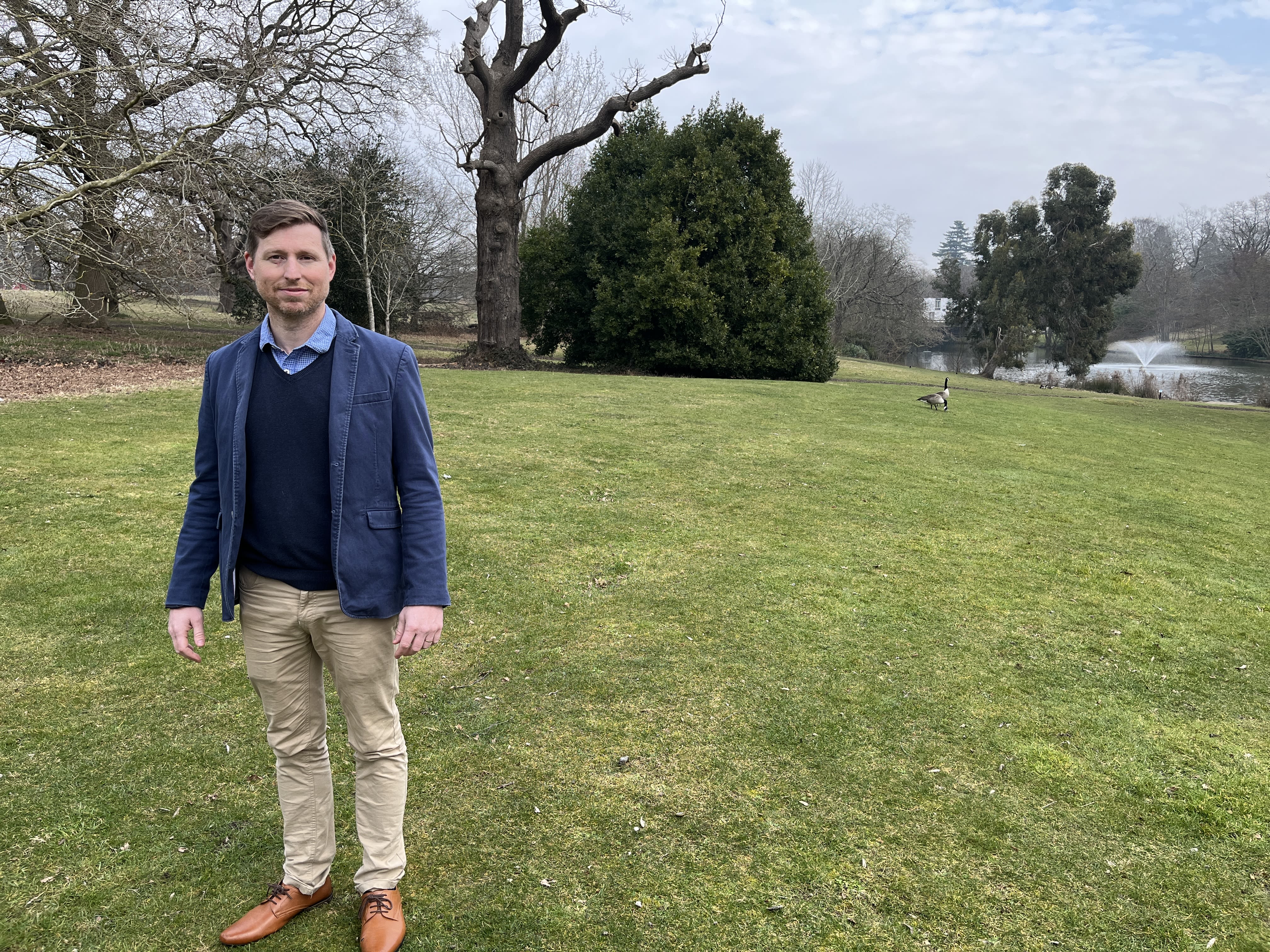 Dr Matthew Gillett standing in Wivenhoe Park