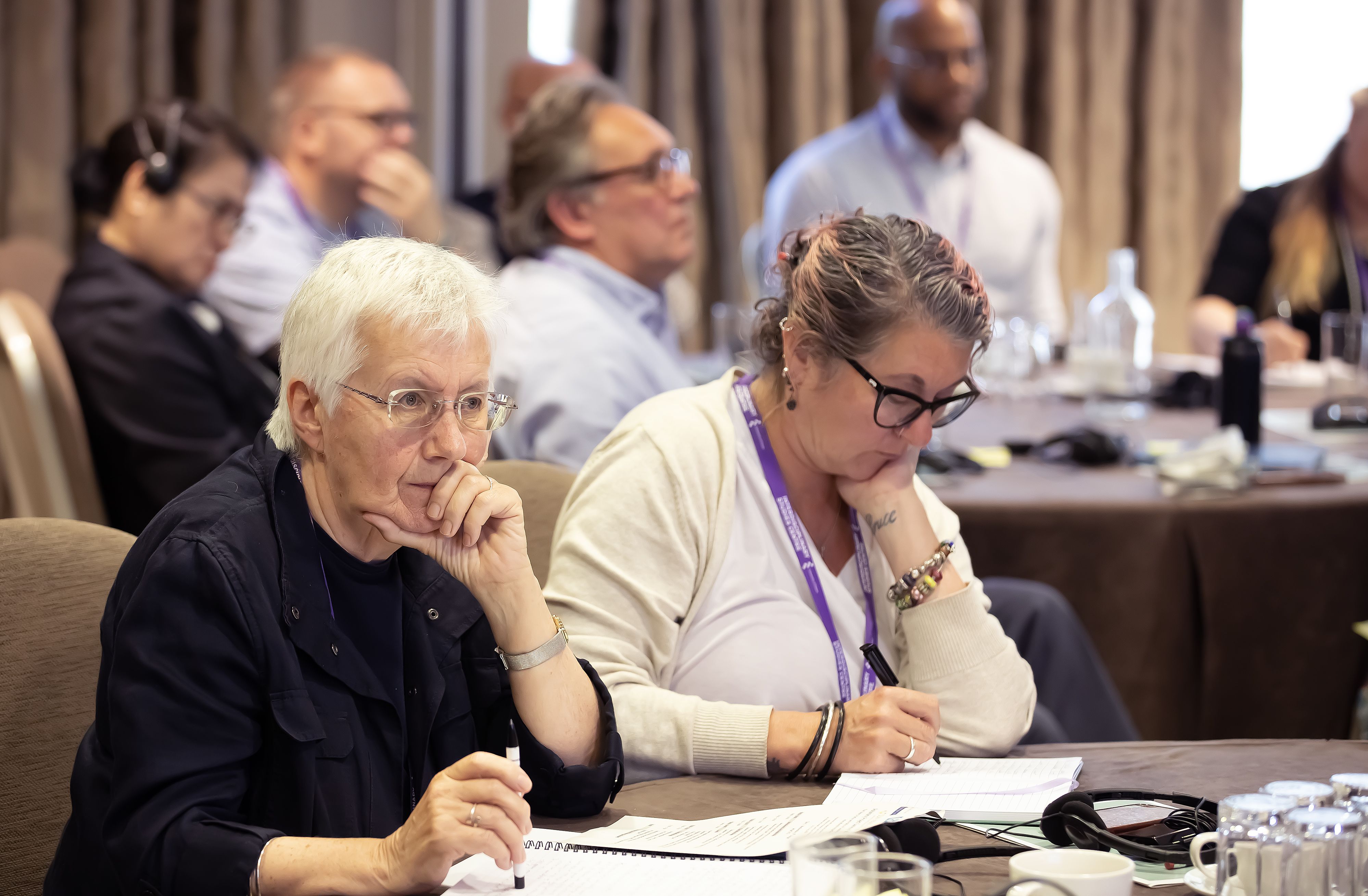 Participants at the Essex Autonomy Project Summer School seated, listening and making notes