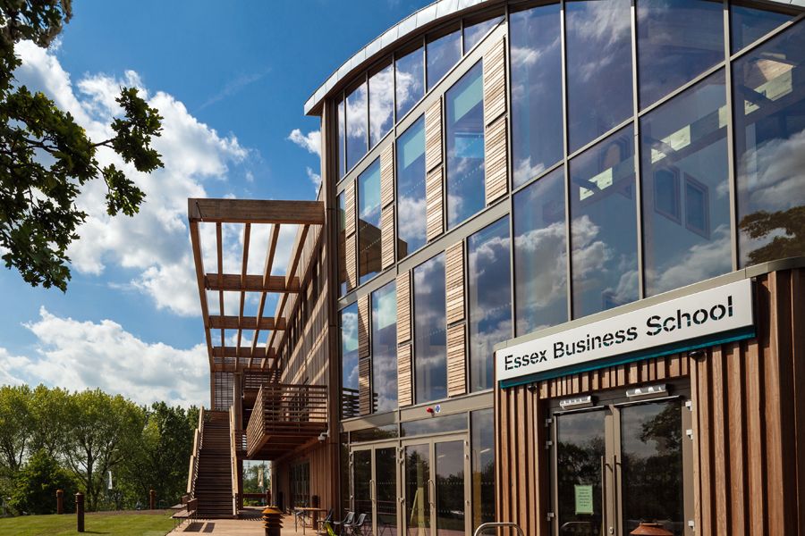 The southern entrance of Essex Business School, showing its large windows and wooden brise soleil.