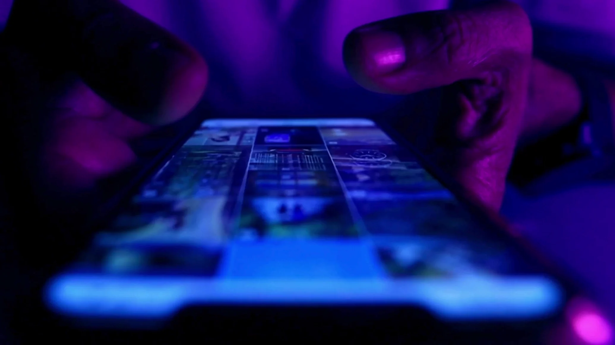 Photo of a hand scrolling through a phone