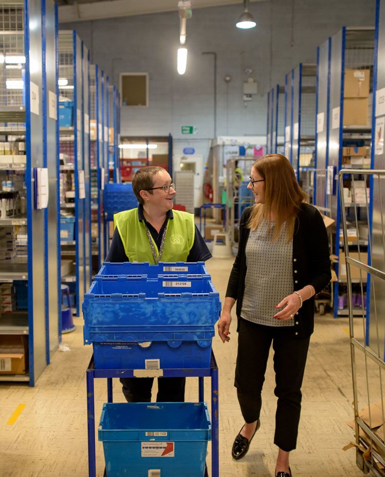 Two woman in a warehouse