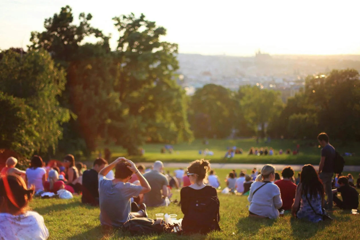 Group of people sitting on a hill